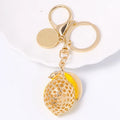 Gold tone rhinestone inlay lemon keyring
