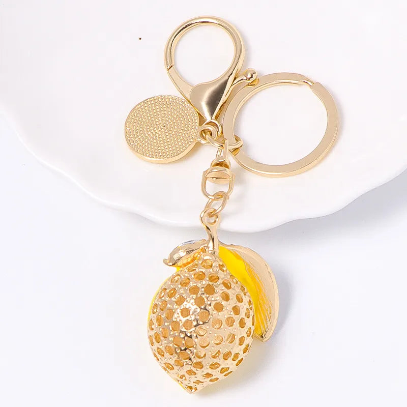 Gold tone rhinestone inlay lemon keyring