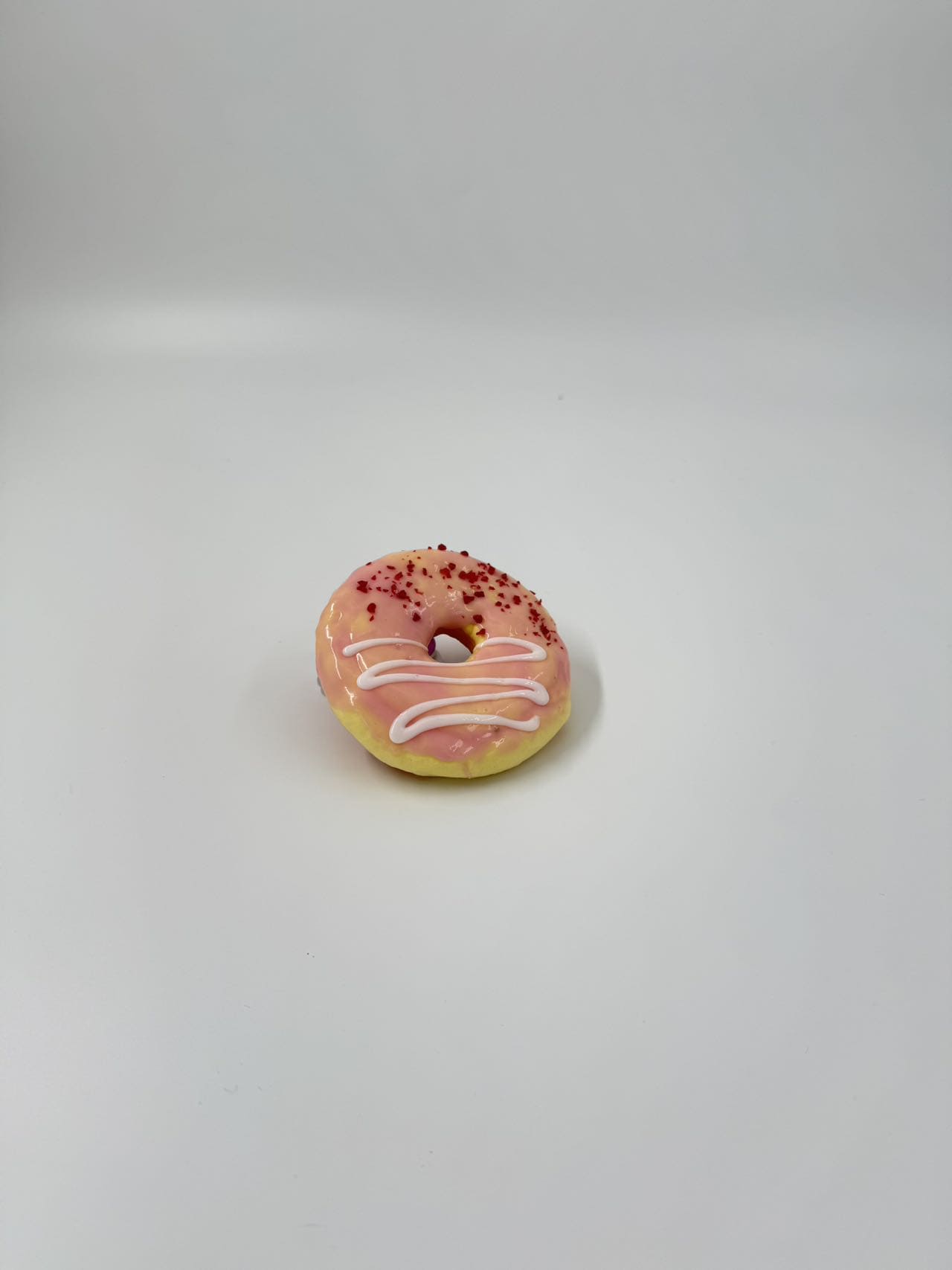 Pistachio glazed donut squishy toy