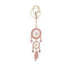 Silver tone dream catcher keyring with bead and feather detail