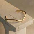 Lilou Gold Minimal Wave Cuff Bracelet 57mm ladies jewellery by FAYA & CO