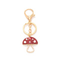 Red and gold tone crystal mushroom keyring